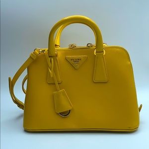Prada small yellow purse.